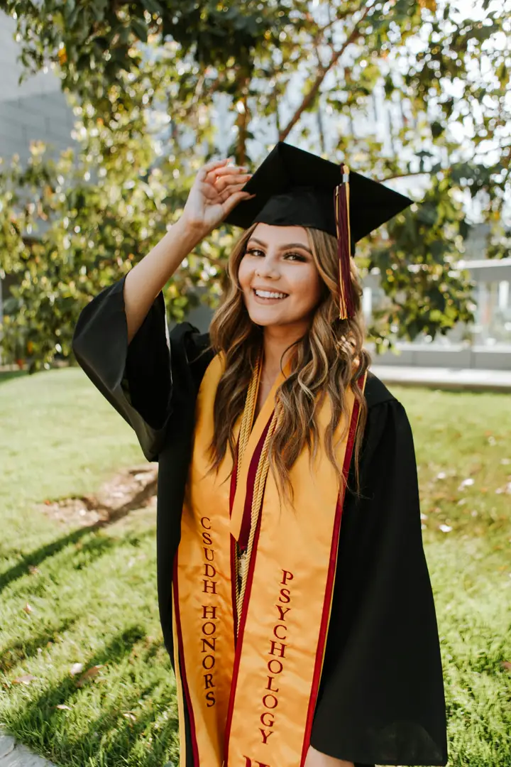 Graduate holding a degree certificate
